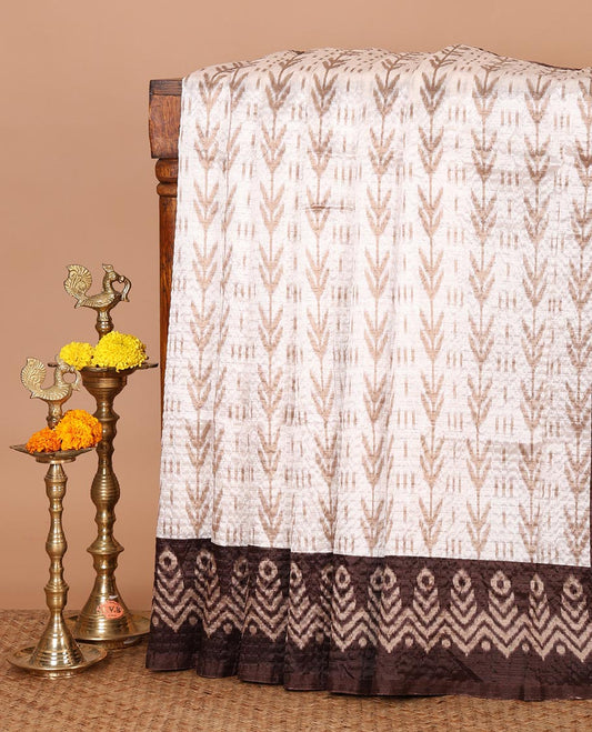 White ikat-style printed Litchi crushed saree, contrast brown ikat border, pallu of ikat chevron & dots & ikat printed blouse