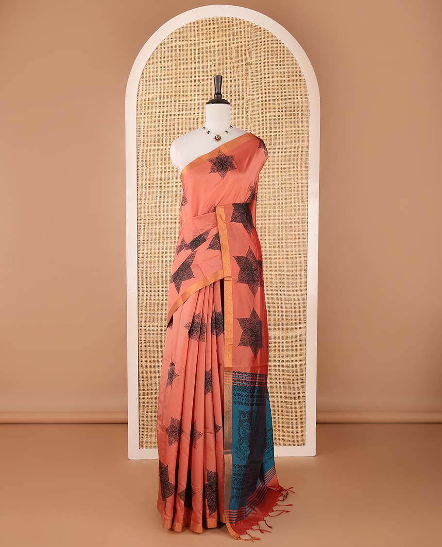 Pink six-petal-like leaf motifs printed micro-silk saree, copper zari border, contrast intricate pallu & plain blue blouse