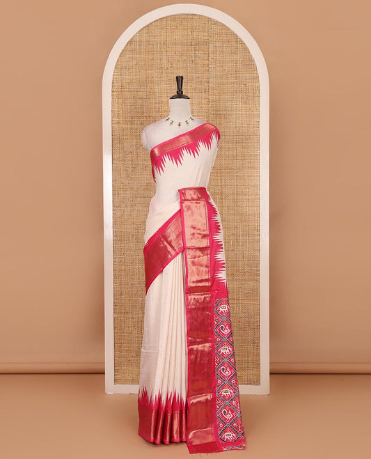 Cream-pink plain dola-tussar saree, contrast temple zari border, patola animal motifs enclosed jaal printed pallu & patola printed blouse