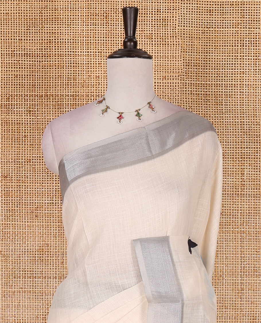 Cream hand painting style deer motifs printed linen cotton saree, silver bavanji border, and vertical stripes printed blouse