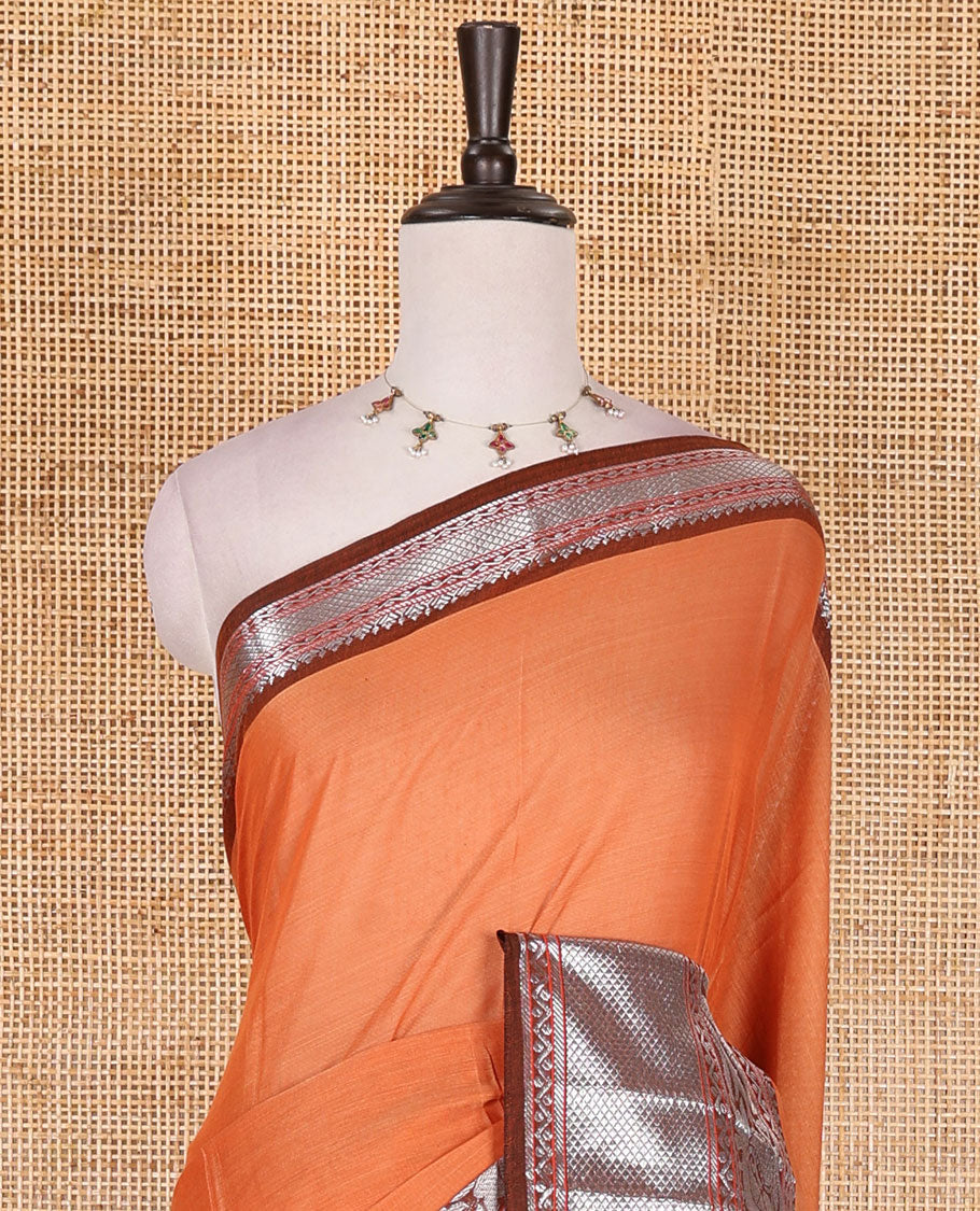 Orange plain mercerised cotton saree, contrast traditional zari border of elephant and peacock designs, striped pallu, and plain blouse