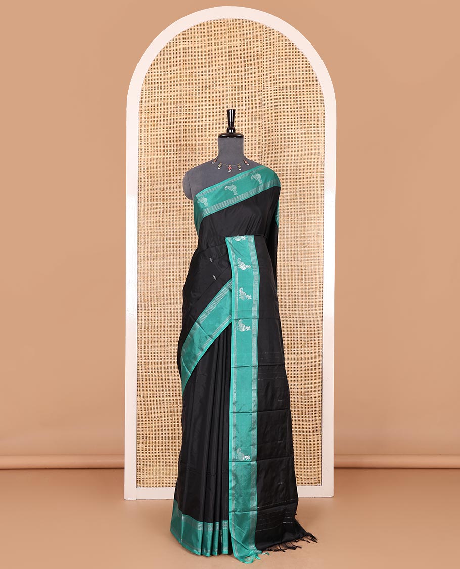 Black zari buttas Kanchi silk saree, contrast peacock motifs zari green border, zari design pallu, and a matching blouse