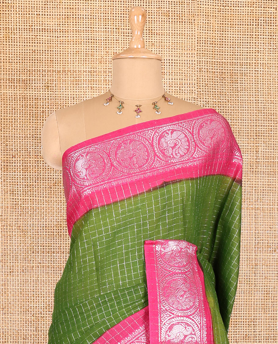 Green and pink checked sungudi cotton saree, contrast silver zari round peacock border, striped pallu, and a contrast checked blouse
