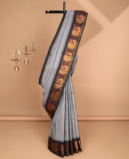 Grey chettinad cotton saree with temple, peacock design border & pathik print blouse