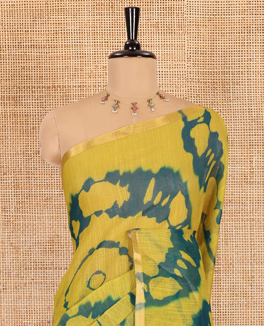 Borderless green big circle shibori printed linen cotton saree, contrast sanganeri floral block printed pallu, and a contrast printed blouse