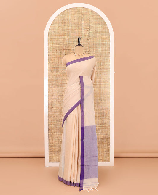 Cream-violet plain mercerised cotton saree,contrast plain  border, striped pallu, and a contrast plain blouse