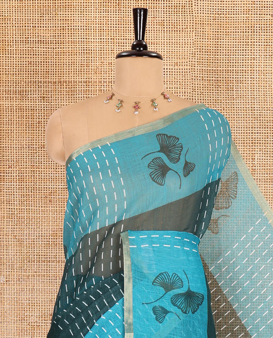 Green vertical striped and floral buttas linen cotton saree, contrast striped and floral printed border, jaal pallu, and a contrast printed blouse