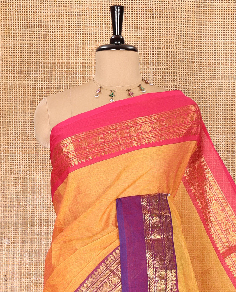 Orange plain Chettinad cotton saree, contrast traditional zari kaal erangina ganga jamuna border, striped pallu, and a matching blouse