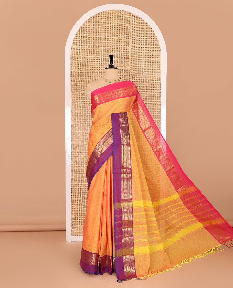 Orange plain Chettinad cotton saree, contrast traditional zari kaal erangina ganga jamuna border, striped pallu, and a matching blouse