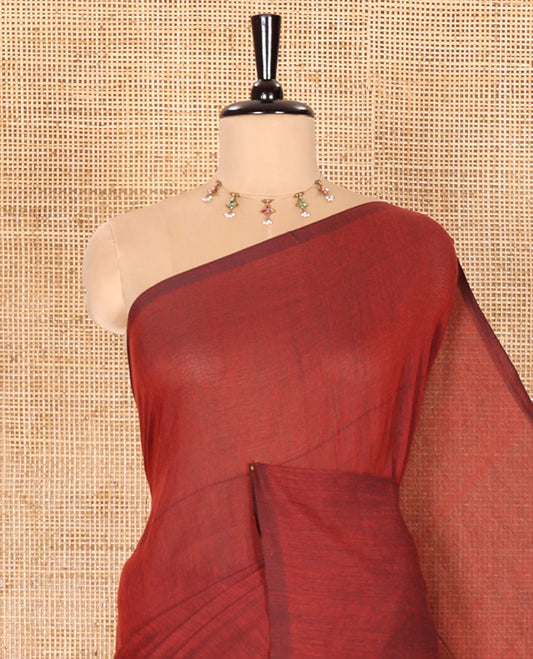 Borderless Maroon Plain Khadi Mul Cotton Saree Features a Self-Pallu with Tassels, and a Matching Blouse