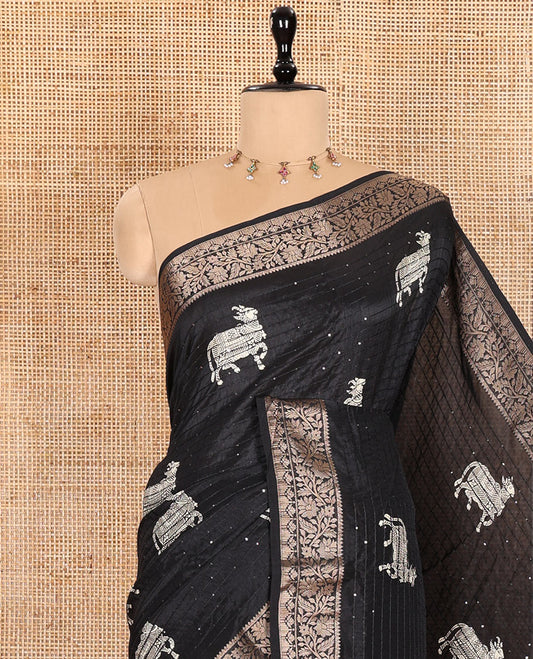 Black Dola Silk Saree Featuring Sequin Stripes and Pichwai Cow Motifs, Decorated with a Floral Creeper Zari-Woven Border, a Printed Pallu, Paired with a Matching Blouse