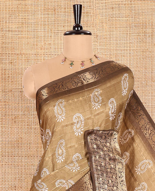 Khaki Brown Dola Silk Saree Embellished with Paisley Buttas, and Horizontal Zari Stripes All Over Its Body, Complemented by Contrast Floral Creeper Zari Design Border, Pallu Steeped with Paisleys, and Paired with a Contrast Blouse