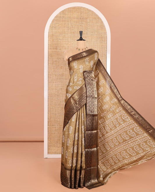 Khaki Brown Dola Silk Saree Embellished with Paisley Buttas, and Horizontal Zari Stripes All Over Its Body, Complemented by Contrast Floral Creeper Zari Design Border, Pallu Steeped with Paisleys, and Paired with a Contrast Blouse