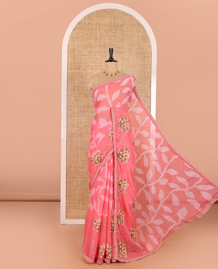 Pink Weightless Chiffon Saree Spotlighted with Leaf Vine Print, Sparkling Glitter Work, and Colorful Floral Motifs Thread Embroidery on Its Body, Comes with a Piping Embroidered Border, and a Matching Jaal Embroidered Blouse