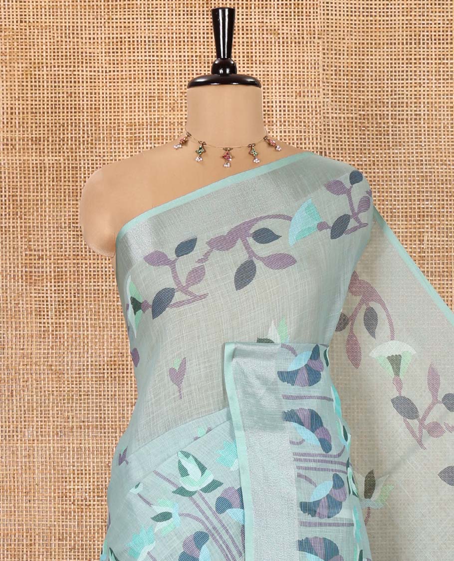 Sea Green Linen Cotton Saree, Accentuated with Jamdani-Style Lotus Designs Printed All Over Its Body, Zari Tissue Border, Pallu Mirrors the Same Print, and Paired with a Matching Blouse