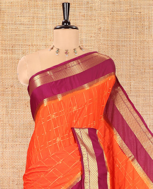 Orange Art Mysore Silk Saree, Richly Detailed with Zari Butta and Zari Checked Design All Over Its Body, Complemented by a Contrast Traditional Zari Rettai Pettu Border, Pallu Steeped in Zari Stripes, and Paired with a Contrast Blouse