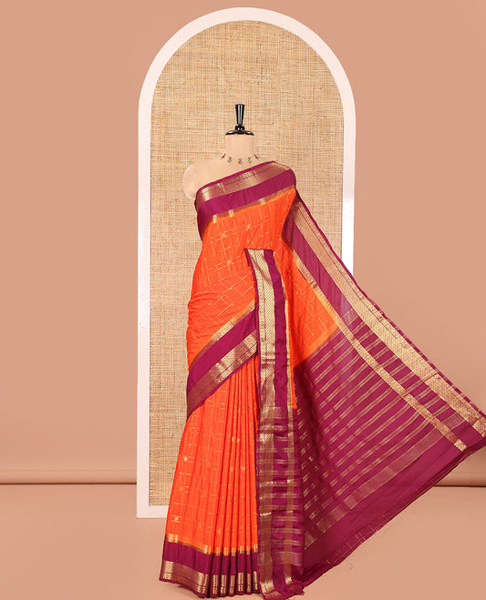 Orange Art Mysore Silk Saree, Richly Detailed with Zari Butta and Zari Checked Design All Over Its Body, Complemented by a Contrast Traditional Zari Rettai Pettu Border, Pallu Steeped in Zari Stripes, and Paired with a Contrast Blouse