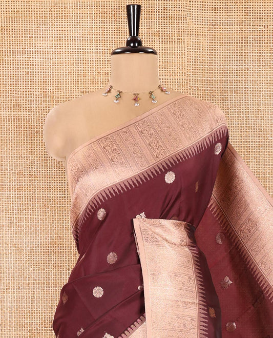 Maroon Kanchi Silk Saree, Woven with Peacock-Chakram Buttas All Over Its Body, Complemented by a Contrast Border of Floral Creeper Designs, an Intricately Designed Pallu, and Paired with a Matching Blouse