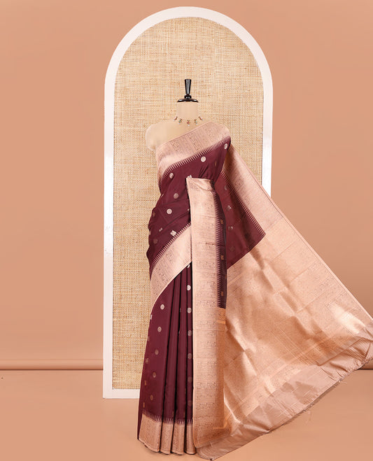 Maroon Kanchi Silk Saree, Woven with Peacock-Chakram Buttas All Over Its Body, Complemented by a Contrast Border of Floral Creeper Designs, an Intricately Designed Pallu, and Paired with a Matching Blouse
