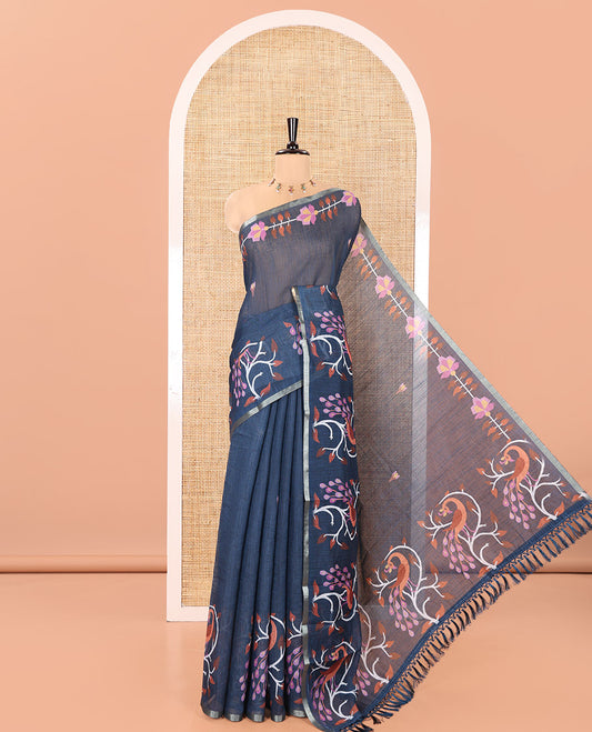 Blue Linen Cotton Saree, Adorned with Floral Motifs in Its Body, Highlighted by a Self-Border of Floral and Peacock Print, Pallu of Peacock Print, and Paired with a Matching Printed Blouse