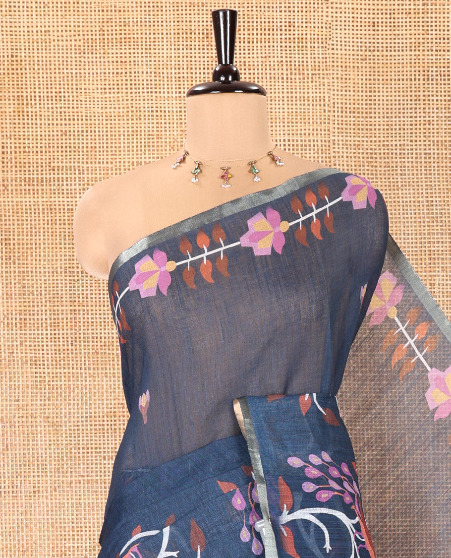 Blue Linen Cotton Saree, Adorned with Floral Motifs in Its Body, Highlighted by a Self-Border of Floral and Peacock Print, Pallu of Peacock Print, and Paired with a Matching Printed Blouse