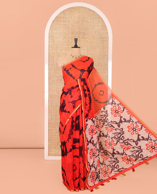 Red Linen Cotton Saree, Showcasing Shibori Printed on Its Body, Subtle Piping Border, Pallu of Floral Vine Print, and Paired with a Contrast Floral Vine Printed Blouse