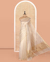 Borderless Off-white Tissue Saree, Steeped with Thin Vertical Zari Stripes All Over Its Body, Highlighted by Gleaming Zari Striped Pallu, and Paired with a Matching Blouse