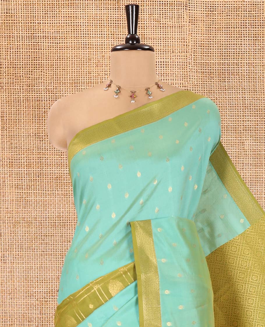 Sea Green and Mehendi Kanchi Silk Saree, Subtly Enriched with Zari Buttas and Buttas Enclosed Checks On Its Body, Complemented by Zari Border, Jaal Pallu, and Paired with a Contrast Jacquard Blouse