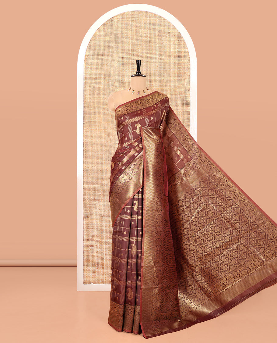 Brown Kanchi Silk Saree, Richly Detailed with Floral- Paisley Butta Enclosed Checks All Over Its Body, Highlighted by Floral Creeper Zari Border, a Grand Jaal Pallu, and Paired with a Jacquard Blouse