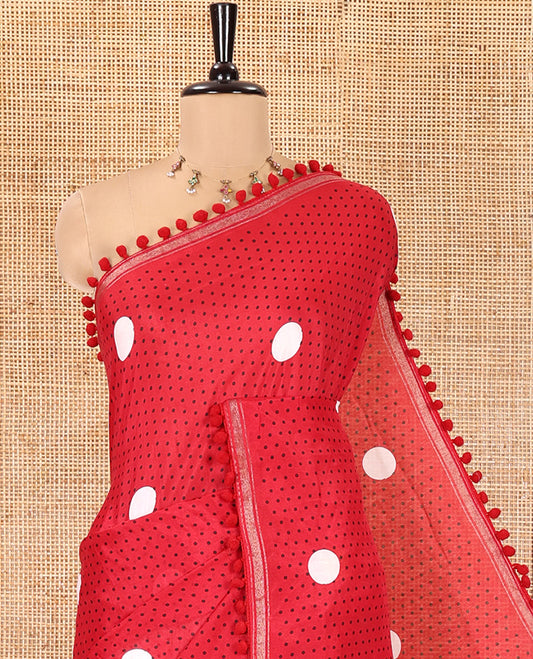 Red Chanderi Cotton Saree, Steeped with Small and Big Polka Dots on Its Body, Subtle Pom-Pom Tasseled Border, a Self-Pallu, and Paired with a Contrast Blouse