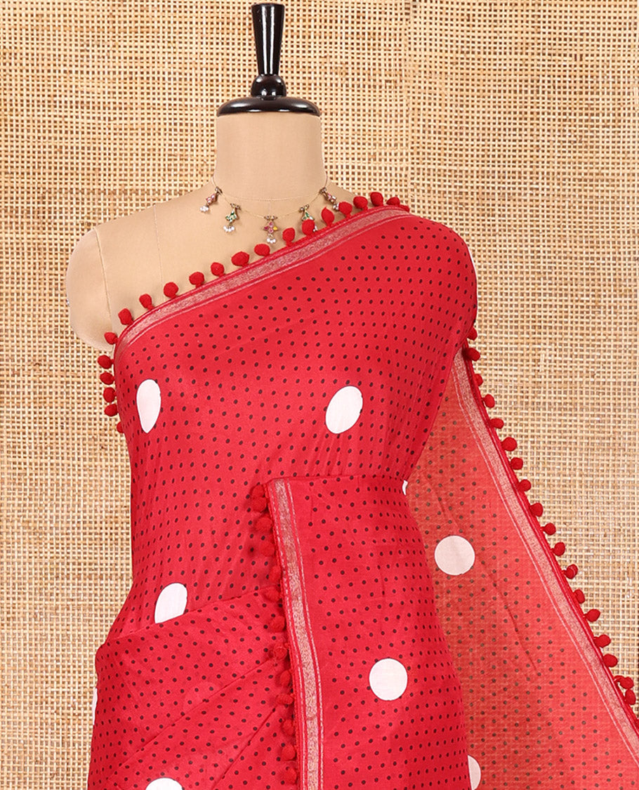 Red Chanderi Cotton Saree, Steeped with Small and Big Polka Dots on Its Body, Subtle Pom-Pom Tasseled Border, a Self-Pallu, and Paired with a Contrast Blouse