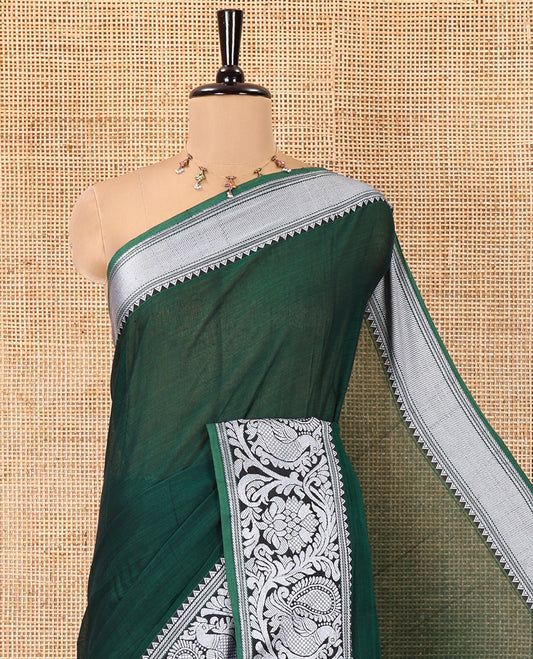 Green Plain Mercerised Cotton Saree, Highlighted by a Self-Border of Temple, Peacock, and Floral Designs,  Striped Pallu, and Paired with a Matching Blouse