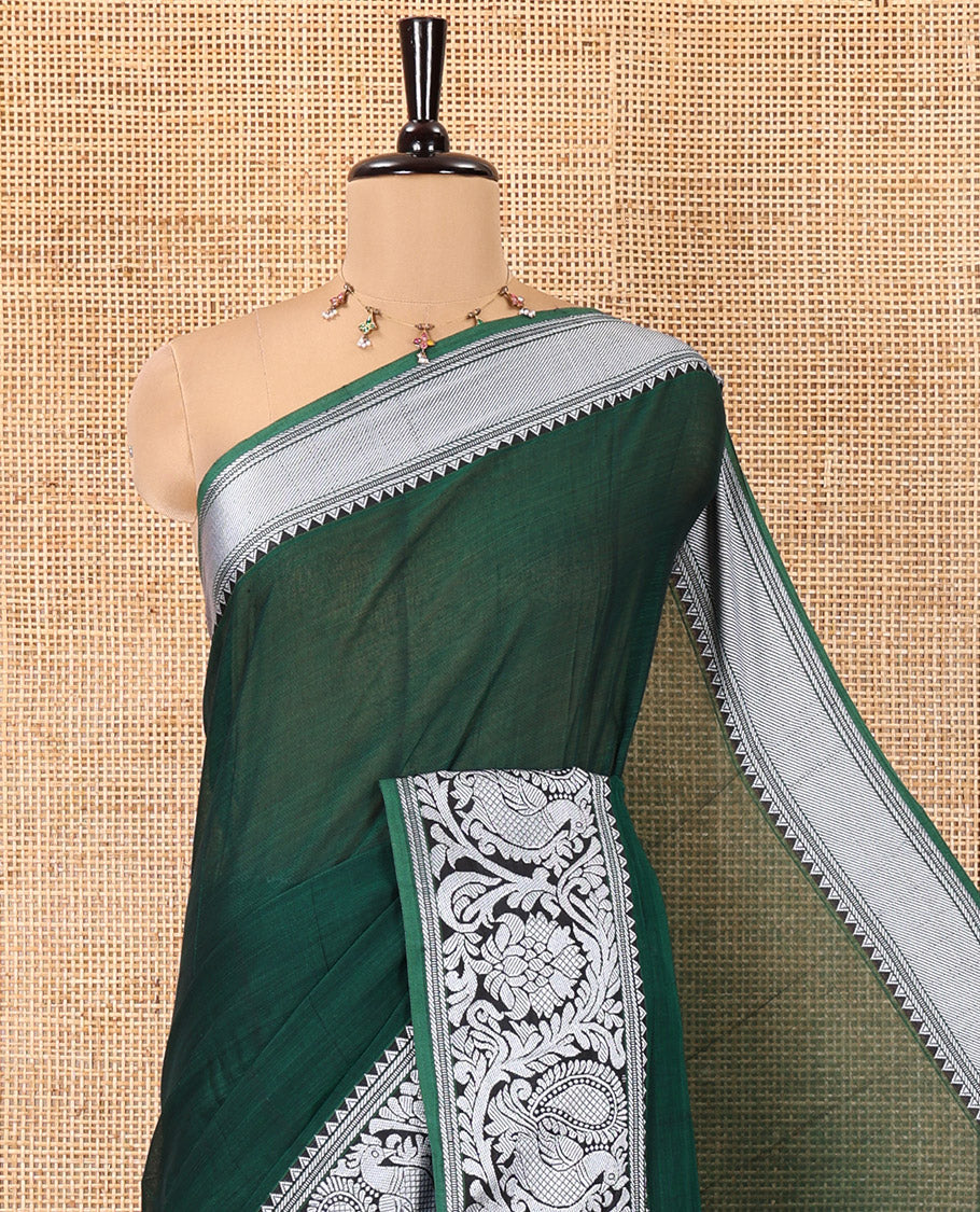 Green Plain Mercerised Cotton Saree, Highlighted by a Self-Border of Temple, Peacock, and Floral Designs,  Striped Pallu, and Paired with a Matching Blouse