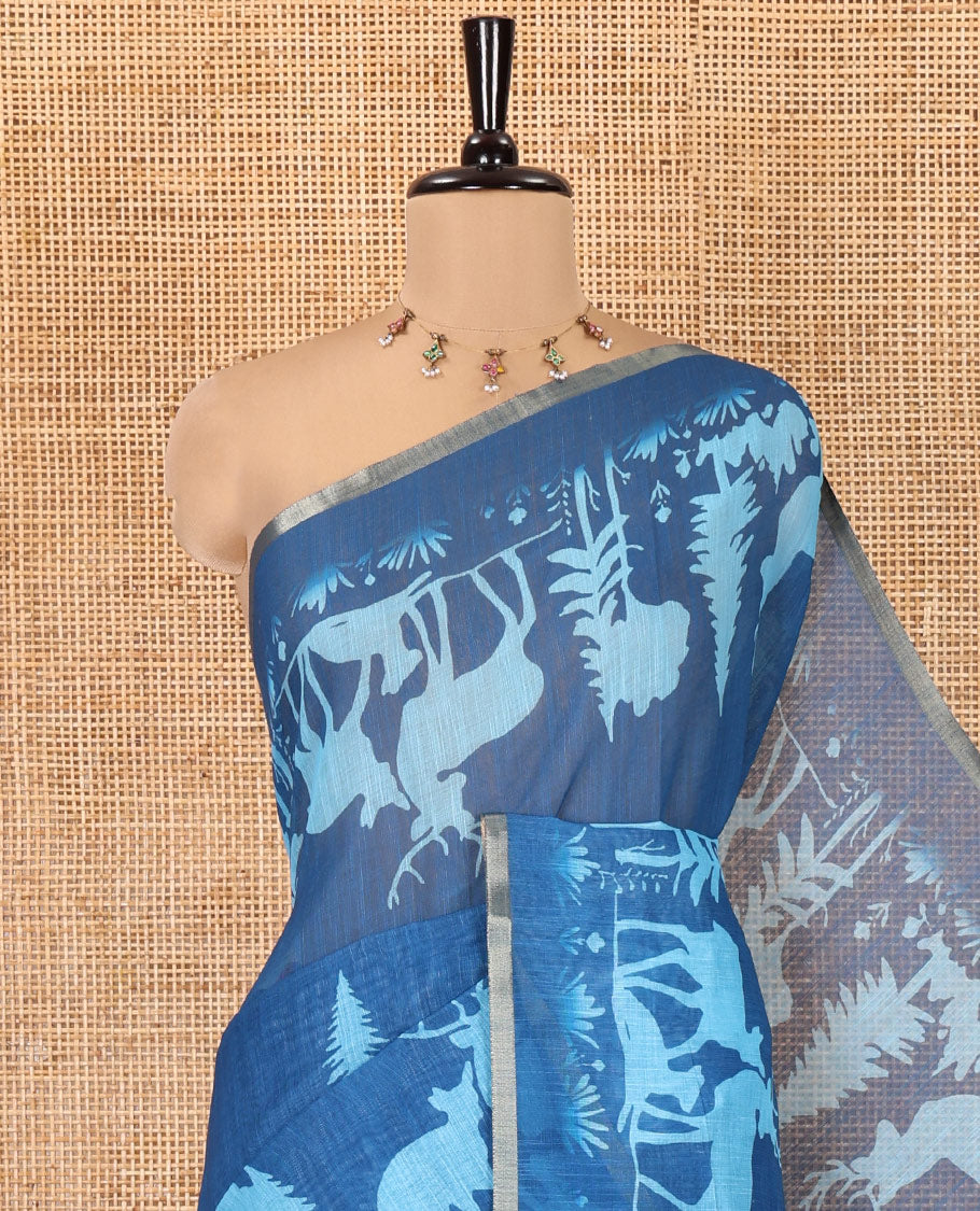 Blue Christmas-Themed Linen Cotton Saree, Bedecked with Christmas Tree Motifs Printed on Its Body, a Subtle Piping Border, Pallu of Christmas-Themed Print, and Paired with a Contrast Floral Printed Blouse