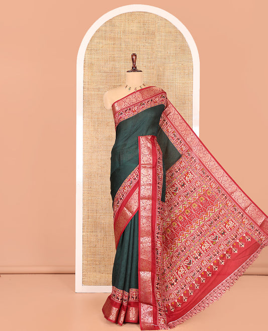 Green Embossed Moss Chiffon Saree, Complemented by a Contrast Traditional Zari Patola Printed Border, Patola Pallu, and a Contrast Blouse