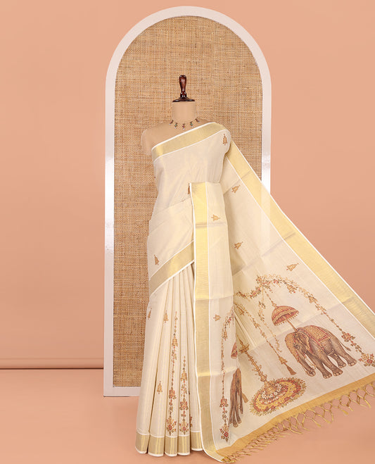 Gold Kerala Cotton Saree, Graced with Bell Motif Print, a Zari Border, Pallu of Elephant Motifs, and a Contrast Blouse
