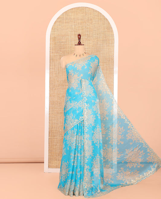 Blue Chiffon Saree Features Abstract Print, a Scallop Sequins Work Border, and Contrast Blouse
