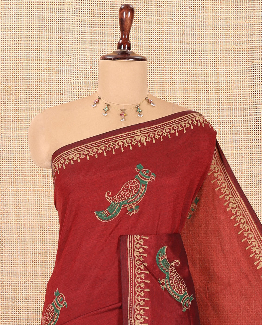 Maroon South Cotton Saree Features Parrot Motifs, a Block-Printed Border, and a Contrast Blouse