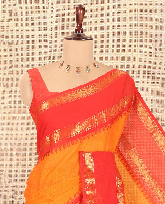 Orange Plain Chettinad Cotton Saree, a Contrast Rettai Pettu Peacock-Chakra Temple Border, Striped Pallu, a Matching Blouse