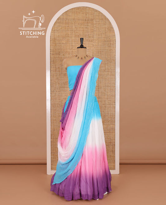 Multi-color half-saree, ombre-colored viscose georgette skirt, a plain blue blouse, and a ombre-colored zari striped dhavani