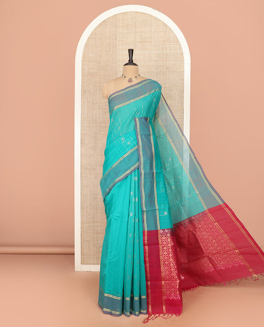 Turquoise Silk Cotton Saree Finely Woven with Zari Designs All Over the Body, Complemented by a Contrast Border, Featuring a Contrast Pallu of Butta Enclosed Honeycomb Grid, and Paired with a Contrast Blouse