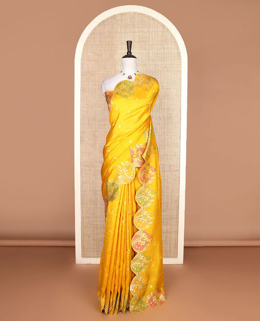 Bright yellow Matka silk saree features rudraksham motifs, scallop floral motifs and bird embossed thread embroidery border