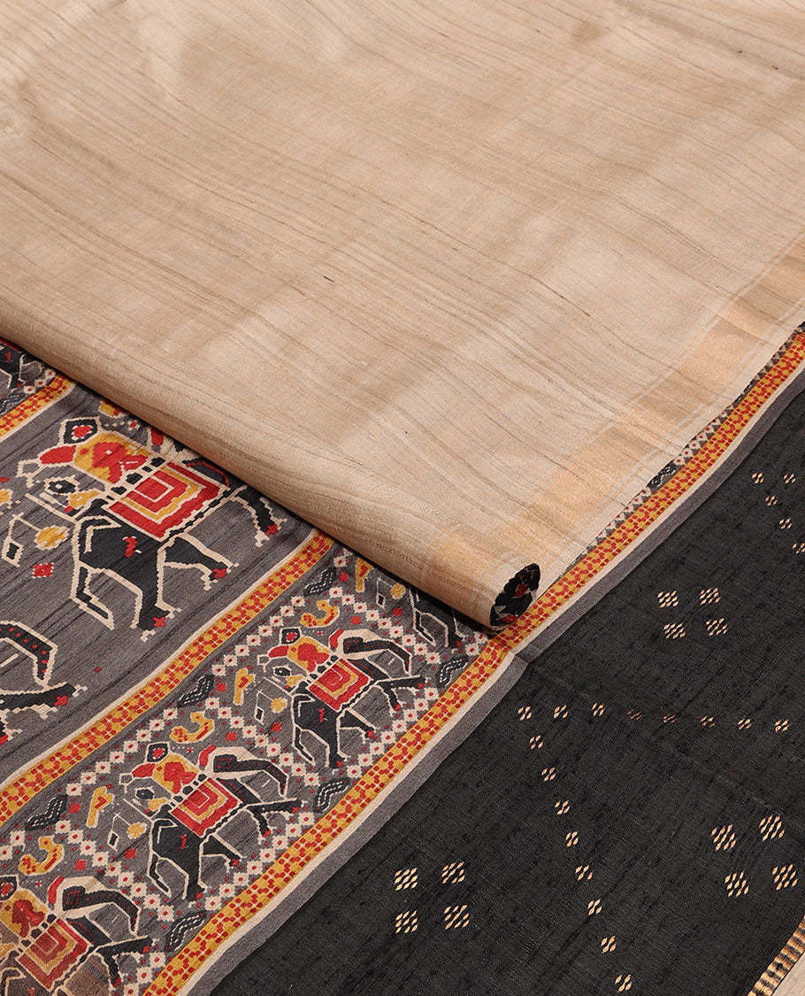 Sandal plain design tussar saree, zari border & contrast pallu adorned with patola-style elephant motifs print