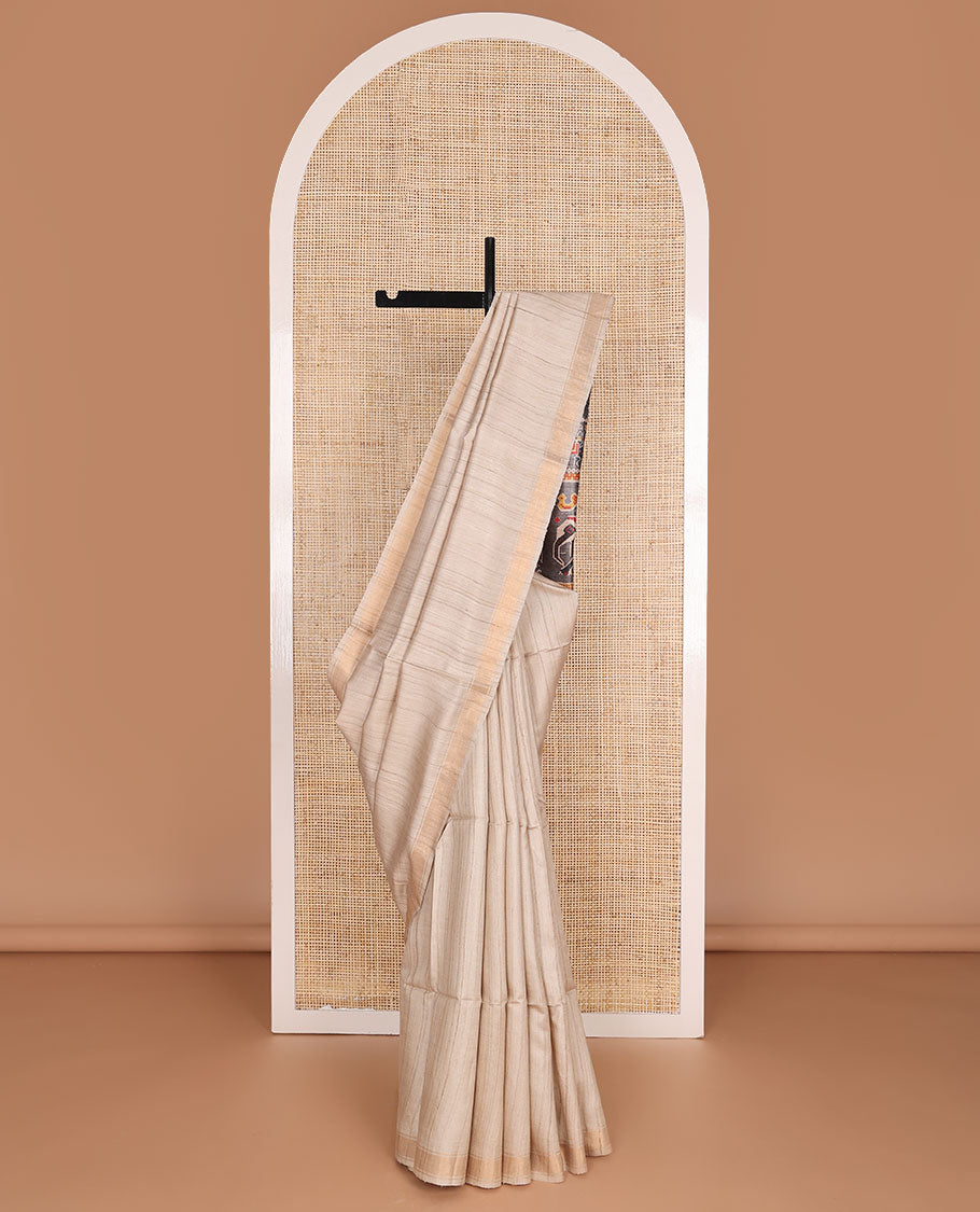 Sandal plain design tussar saree, zari border & contrast pallu adorned with patola-style elephant motifs print