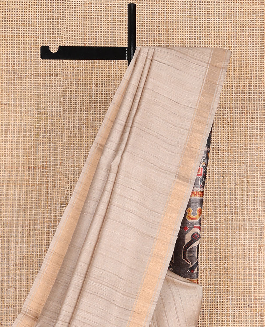 Sandal plain design tussar saree, zari border & contrast pallu adorned with patola-style elephant motifs print