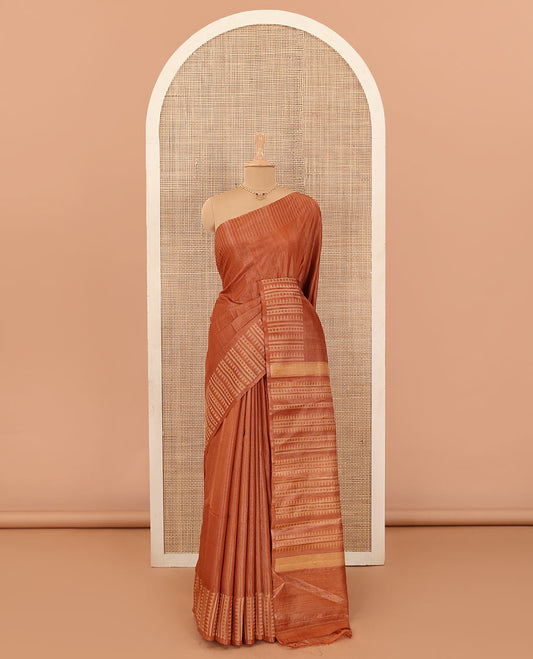Orange buttas tussar silk saree, self-border and pallu steeped with temple and rudraksham designs