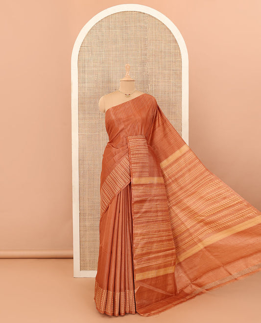 Orange buttas tussar silk saree, self-border and pallu steeped with temple and rudraksham designs