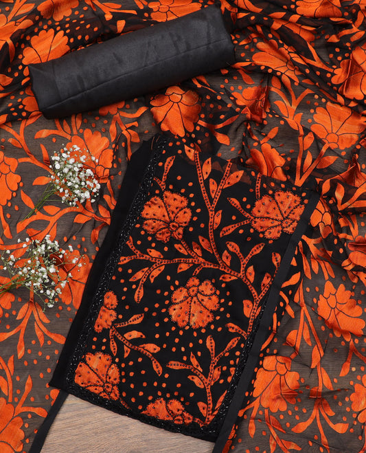 Black material chudidar set, orange floral vine print with black micro stone neck work top, plain bottom and floral vine printed dupatta
