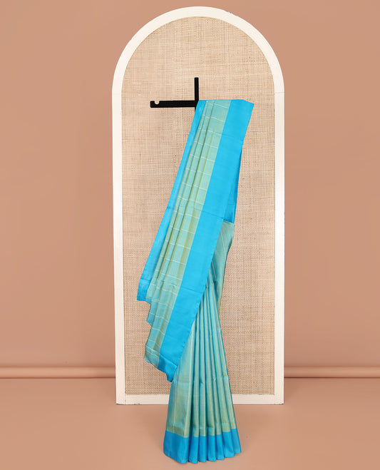 Blue Uppada Silk Saree, Subtly Sparkled with Stripes On Its Body, Complemented by a Contrast Plain Border, Plain Pallu, and Paired with a Contrast Blouse