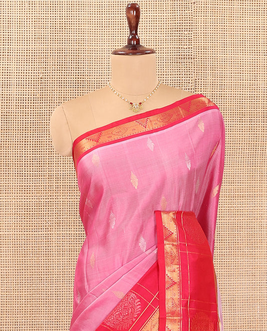 Pink Uppada Silk Saree Detailed with Zari Buttas All Over Its Body, Complemented by a Contrast Border of Traditional Zari Designs, Sparsely Sparkled Pallu of Floral-Paisley Designs, and Paired with a Contrast Blouse